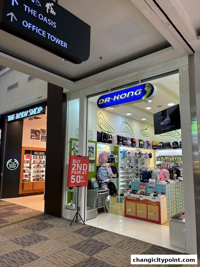 Dr. Kong shoe store entrance with bags, shoes, and a 50% off sale sign.