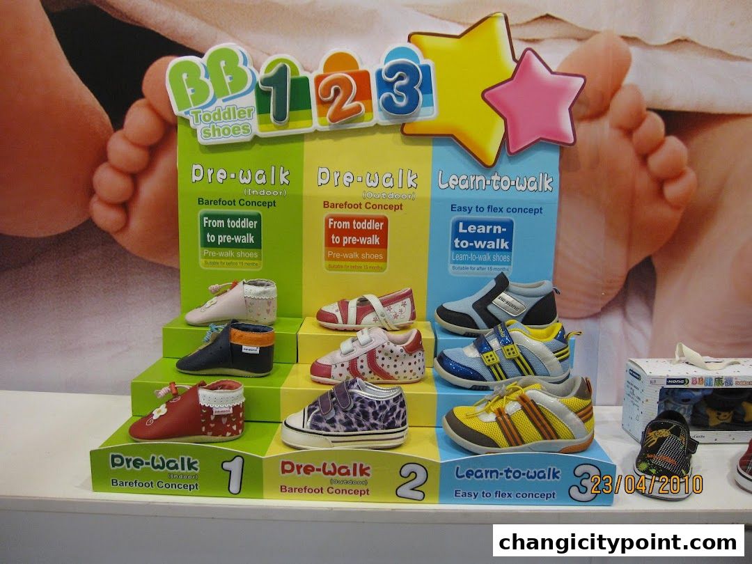 Display of Dr. Kong toddler shoes categorized by developmental stage.