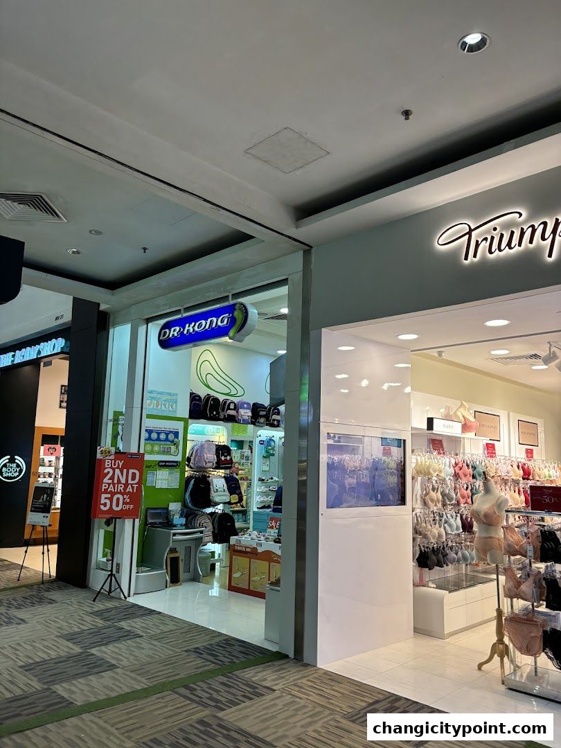The entrance of Dr. Kong shoe store and Triumph lingerie store in a mall.