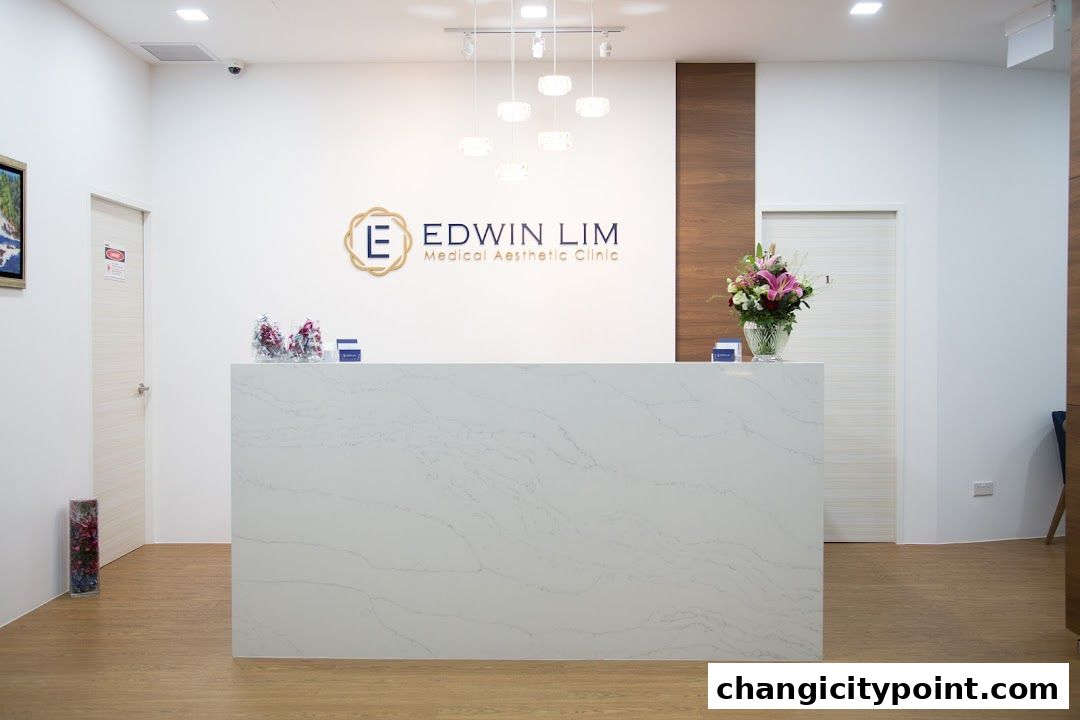 The reception area of Edwin Lim Medical Aesthetic Clinic with a white counter and clinic logo.