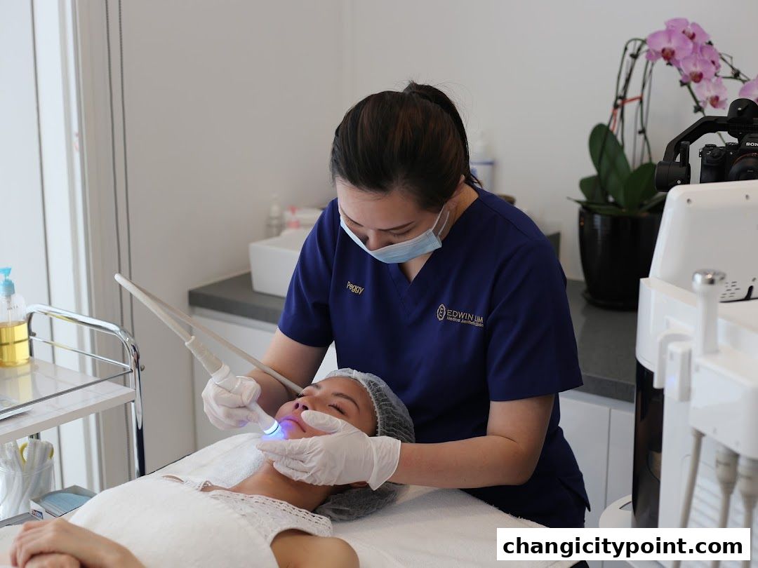 Aesthetician performing a facial treatment on a client in a clinic.