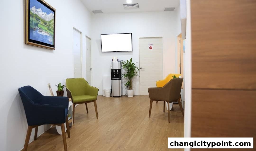 A clean and modern clinic waiting area with comfortable seating and a water dispenser.
