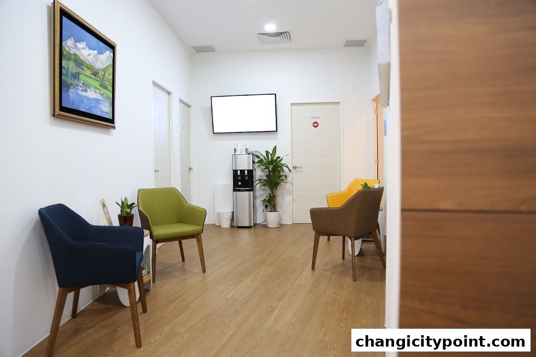 A clean and modern clinic waiting area with comfortable seating and a water dispenser.
