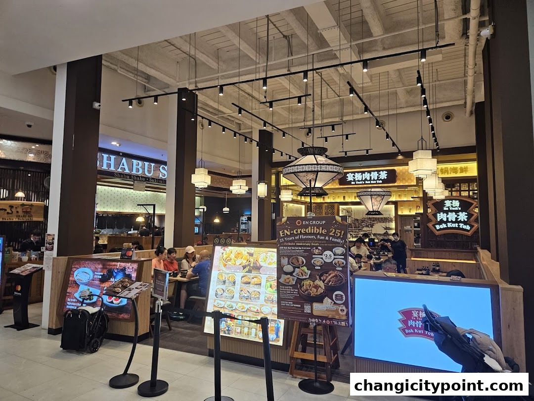 Interior view of En Yeohs Bak Kut Teh restaurant with seating and promotional displays.