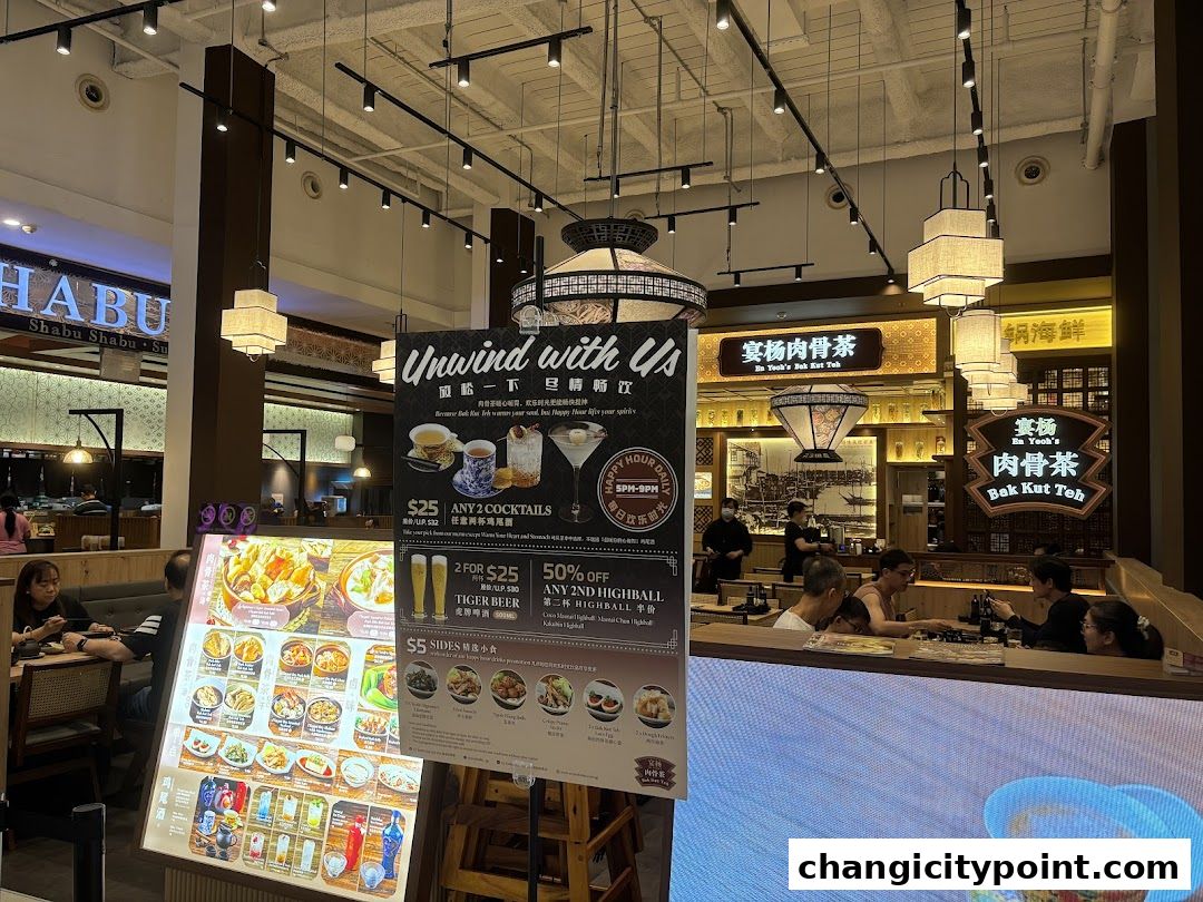 Interior view of En Yeohs Bak Kut Teh restaurant with a menu board and diners.