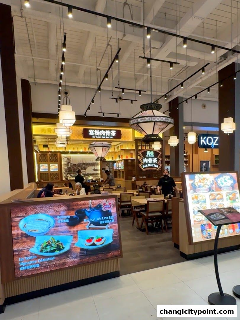 Interior view of En Yeohs Bak Kut Teh restaurant with digital menu displays.