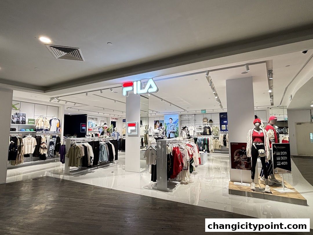 Interior view of a FILA outlet store showcasing apparel and mannequins.