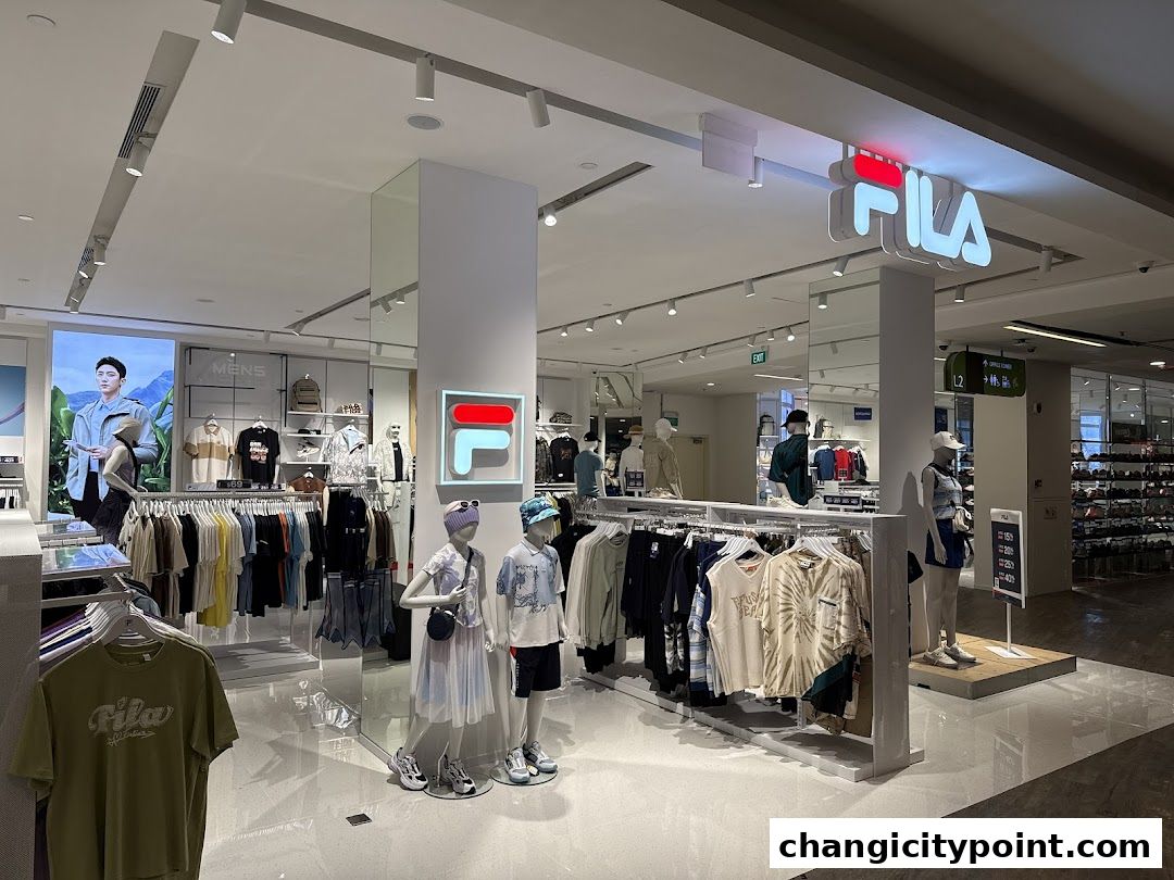 Interior view of a Fila Outlet store showcasing apparel and mannequins.