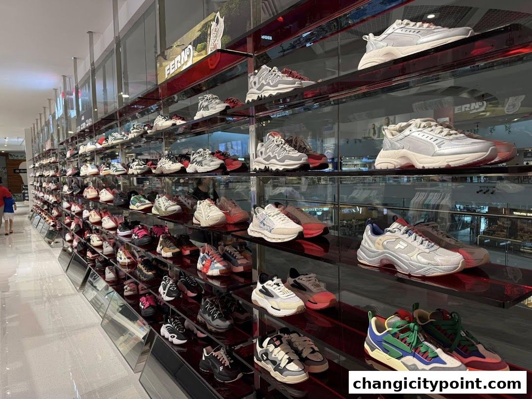 A wide selection of athletic shoes displayed on shelves in a retail store.
