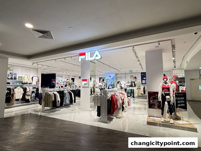 Interior view of a FILA outlet store showcasing apparel and mannequins.