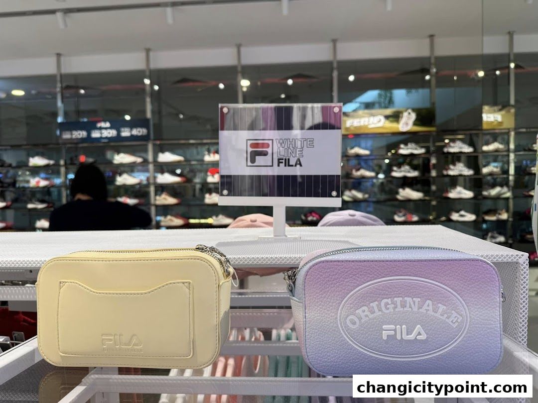 Two FILA bags displayed in front of shelves filled with shoes.