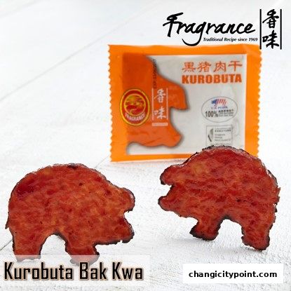 Two pig-shaped Kurobuta Bak Kwa pieces with a packet in the background.