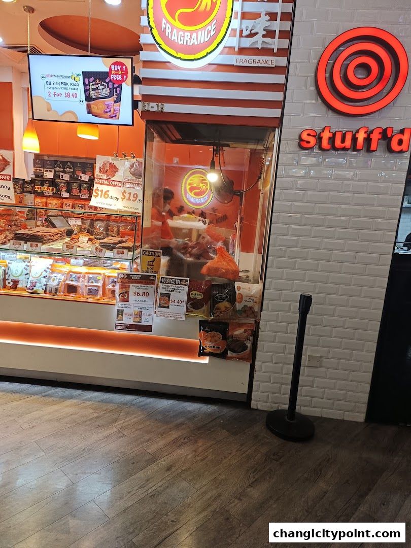 Fragrance Bak Kwa shop front with display of bak kwa and promotional offers.