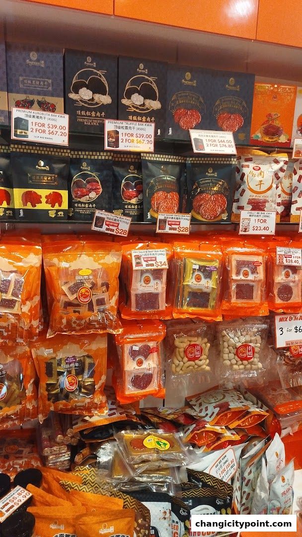 A display of various packaged bak kwa and snacks in a retail shop.