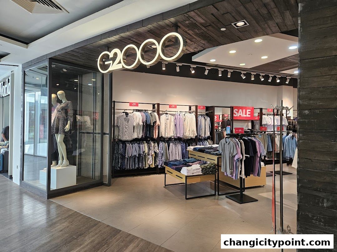 G2000 clothing store interior with mannequins and racks of apparel.