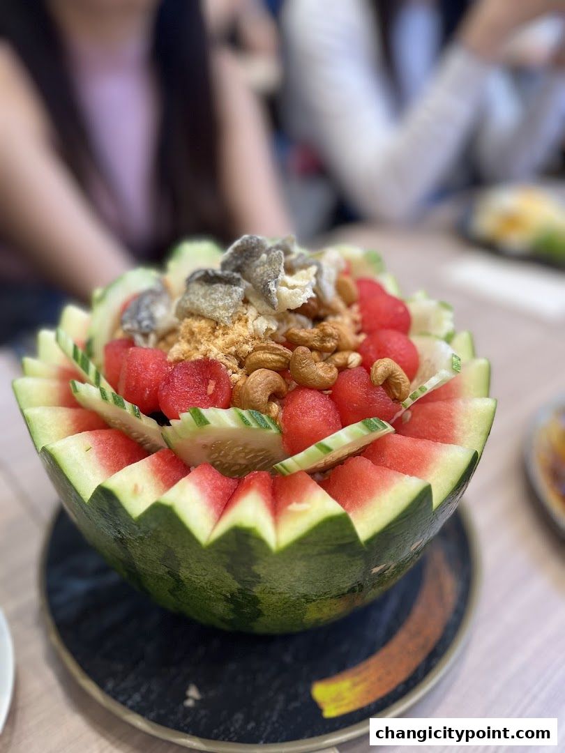 A refreshing watermelon salad with cucumber, cashews, and crispy toppings.