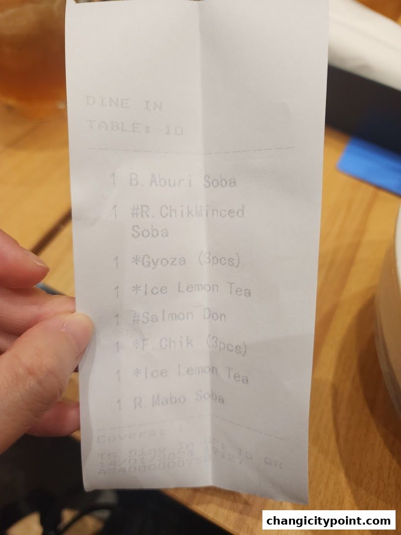 A receipt showing a list of food and drink items ordered at a table.