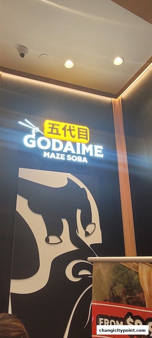 The illuminated sign for Godaime Maze Soba features Japanese characters and a stylized graphic.