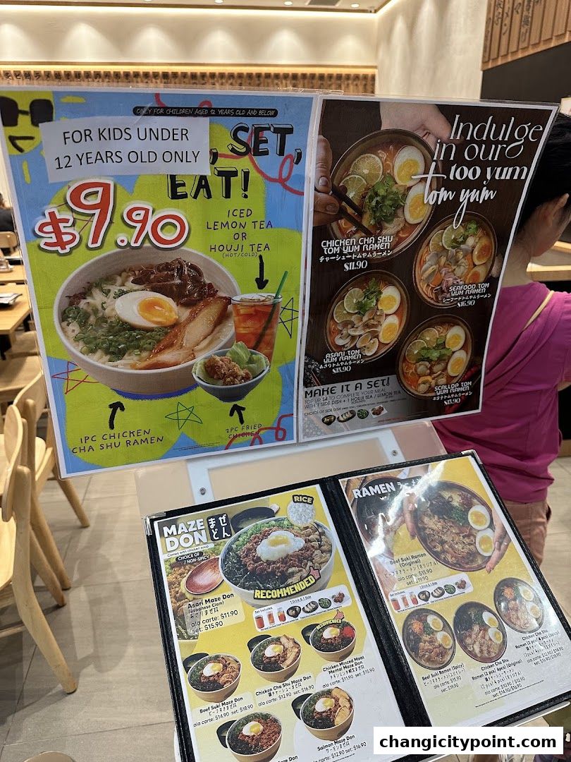 A menu display featuring ramen and maze don dishes with prices and images.