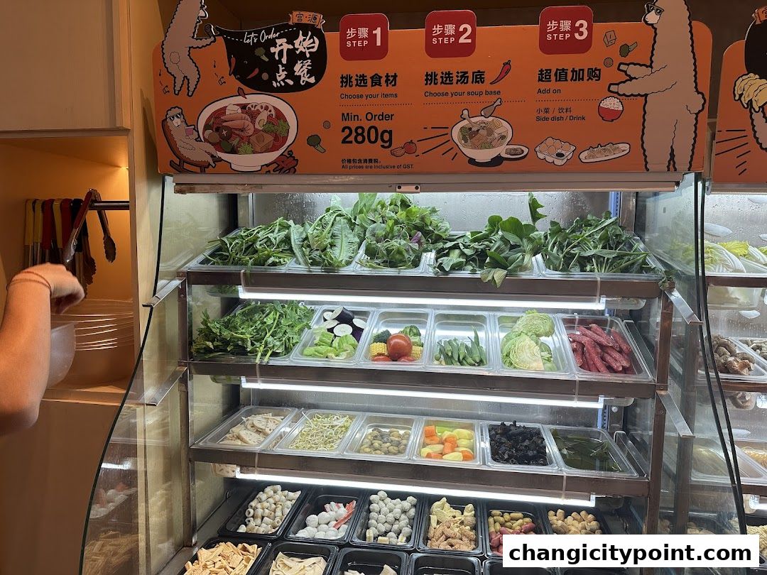 A display of fresh ingredients for Mala Tang, with instructions on how to order.