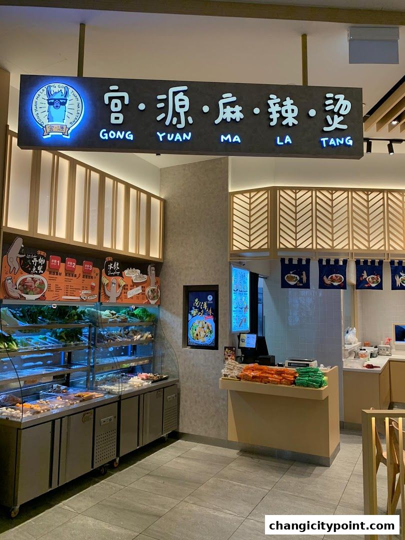 Interior view of Gong Yuan Ma La Tang with fresh ingredients and a counter.