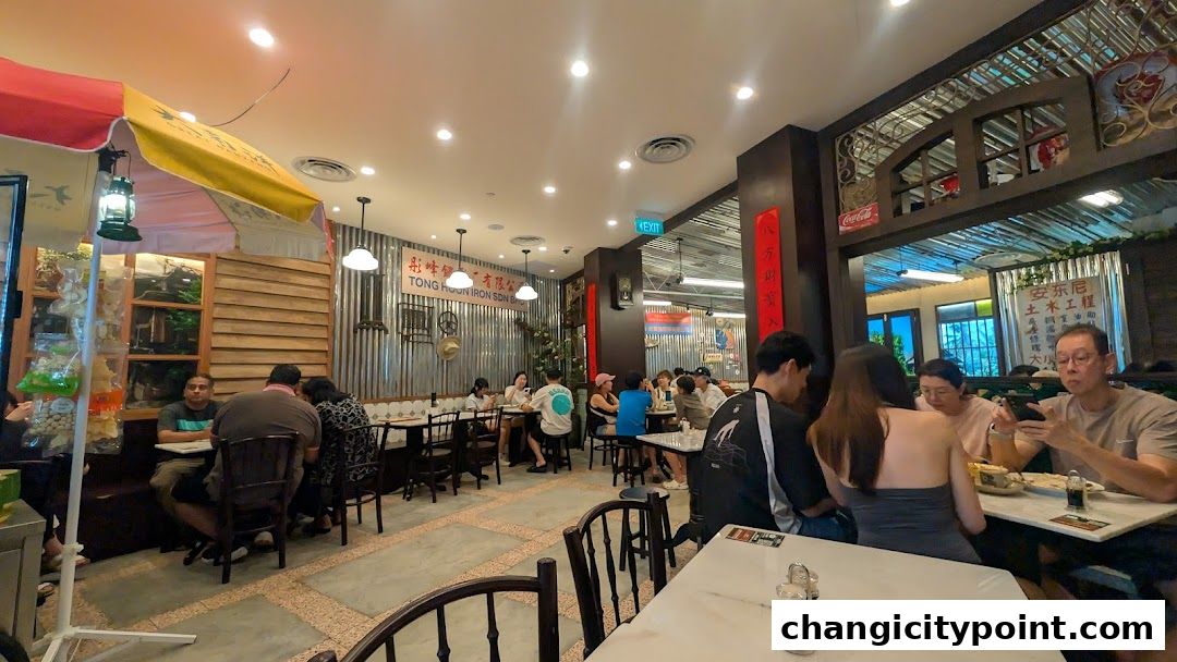Interior view of a cafe with patrons dining and a rustic, heritage-themed decor.