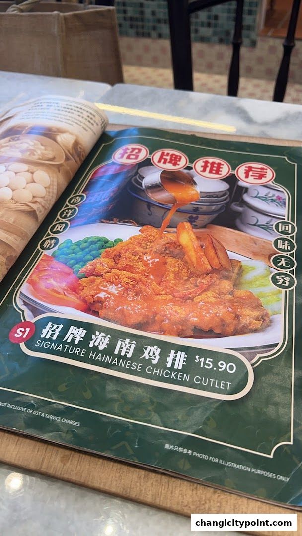 A menu featuring a signature Hainanese chicken cutlet with fries and peas.