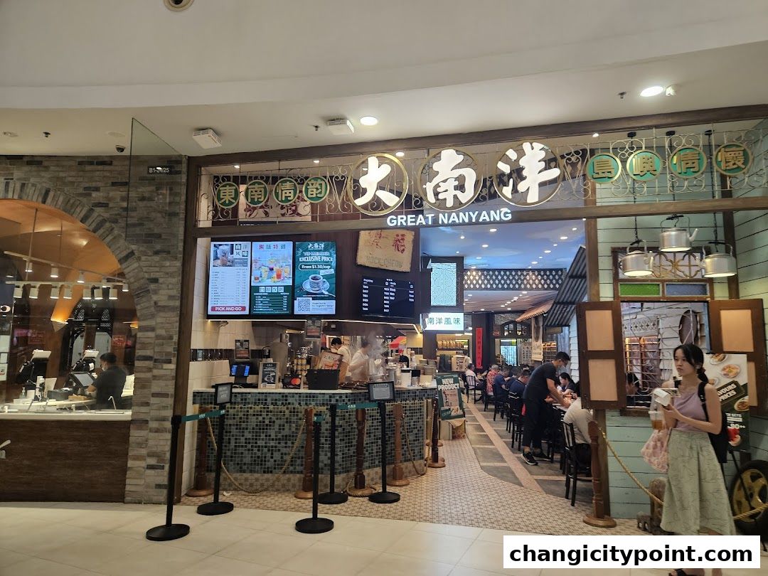 The entrance of Great Nanyang Heritage Cafe with seating and a counter.