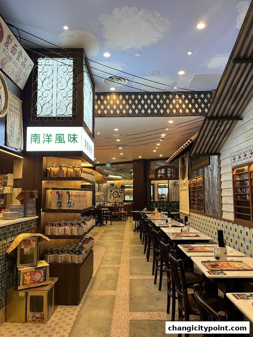 Interior view of Great Nanyang Heritage Cafe with seating and retail display.