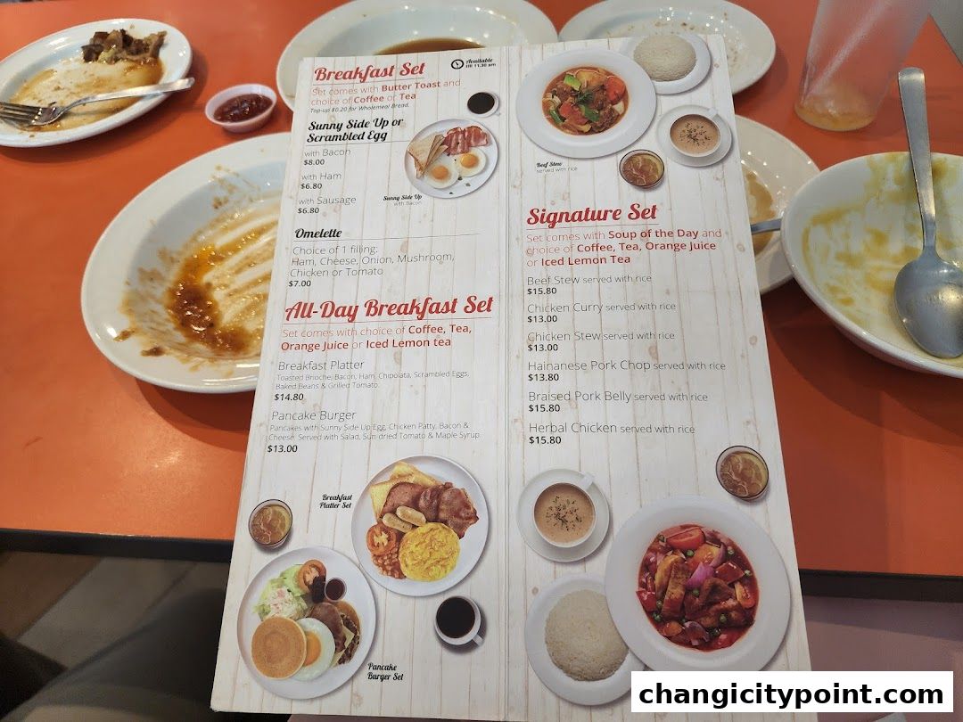 A menu from Hans Cafe Changi City Point showing breakfast and signature sets.