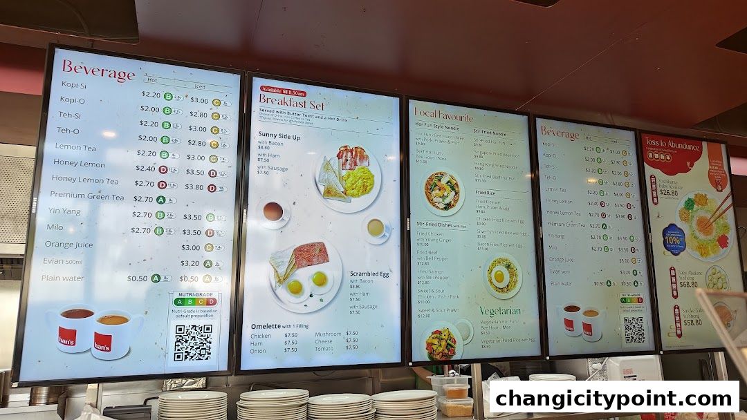 A digital menu board displaying beverages, breakfast sets, local favorites, and vegetarian options.