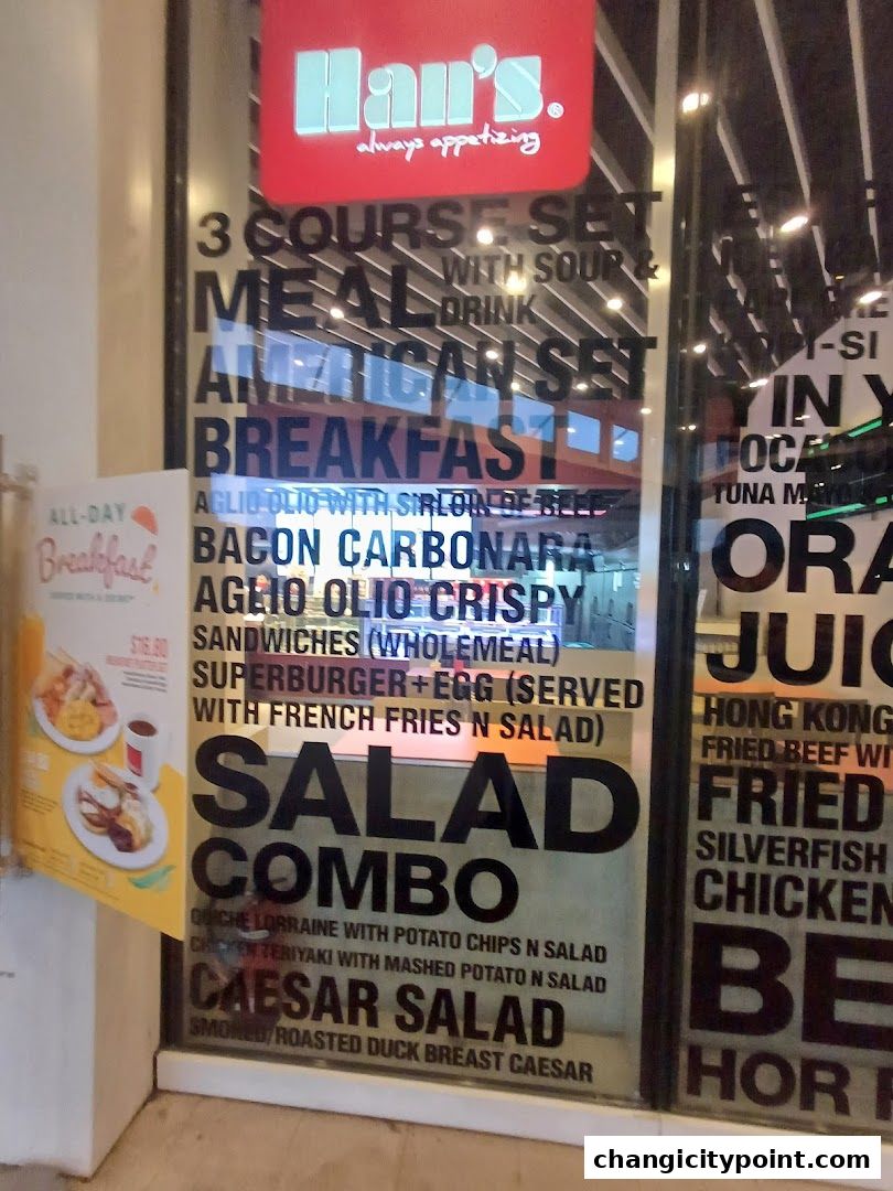 A shop window displaying various food items and meal combos offered by Han's Cafe.