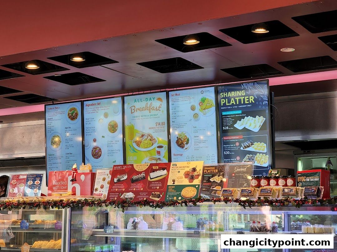 A display of food and pastry offerings at Hans Cafe, including set meals and sharing platters.