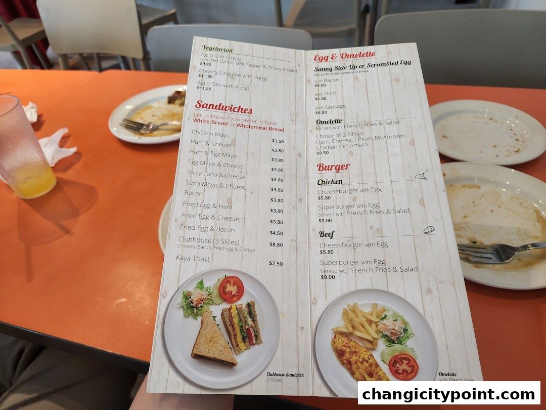 A menu from Hans Cafe Changi City Point showing various food items and prices.