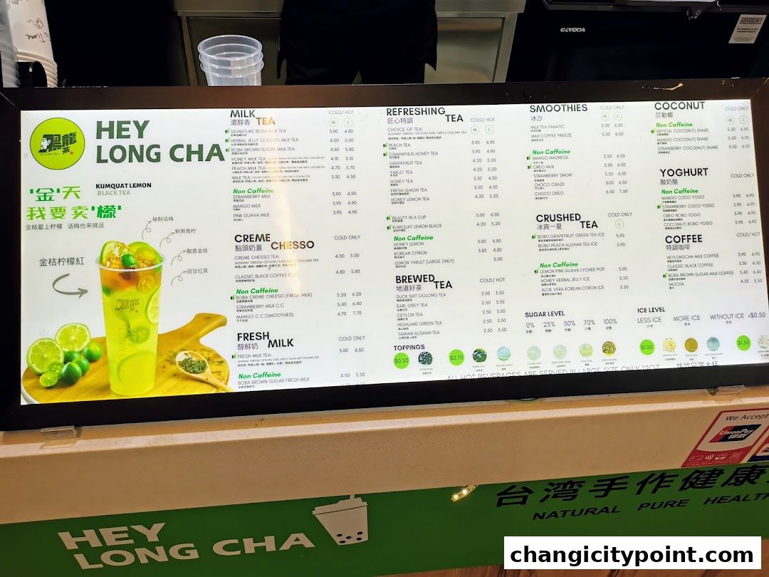 A digital menu board for Hey Long Cha, showcasing various milk teas, smoothies, and coffee drinks.