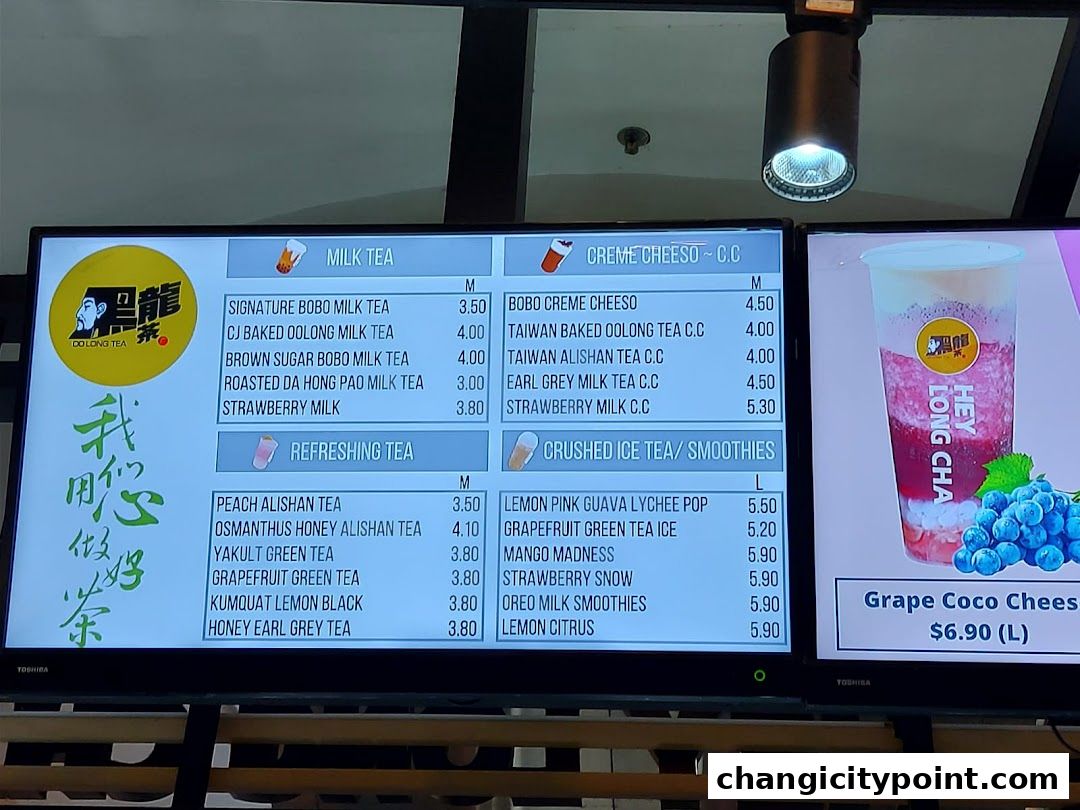 A digital menu board displaying various milk teas, refreshing teas, and smoothies with prices.
