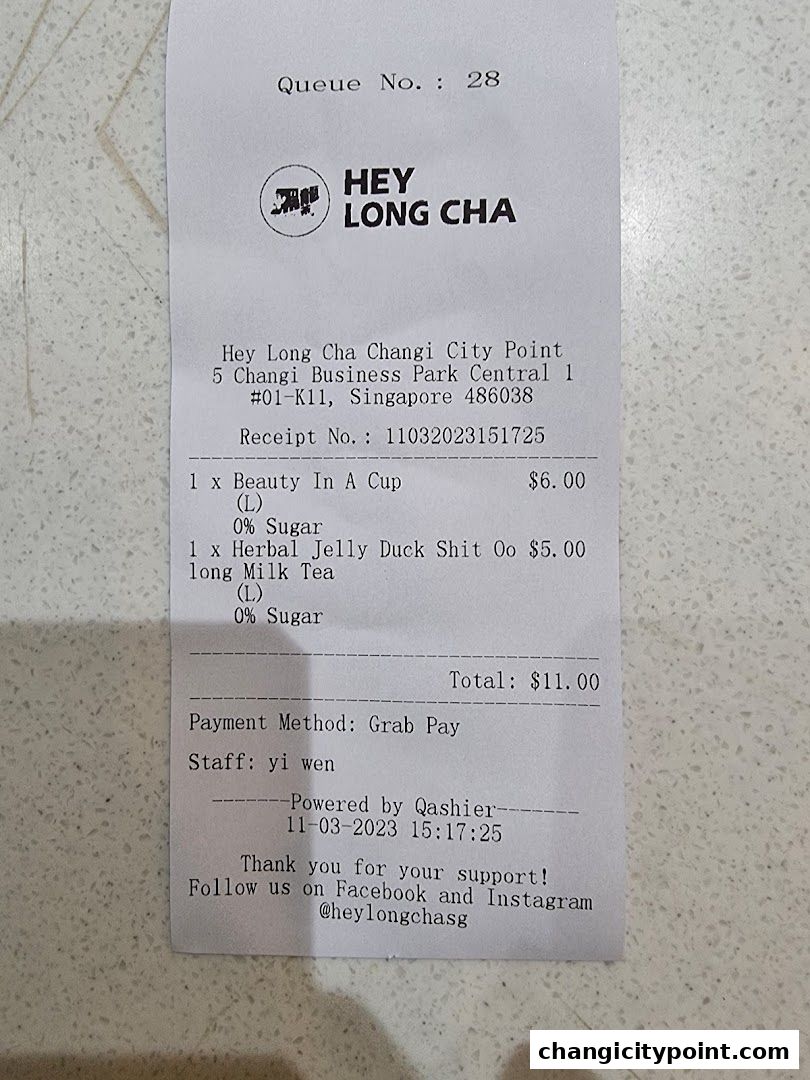 A receipt from Hey Long Cha showing purchased drinks and total cost.