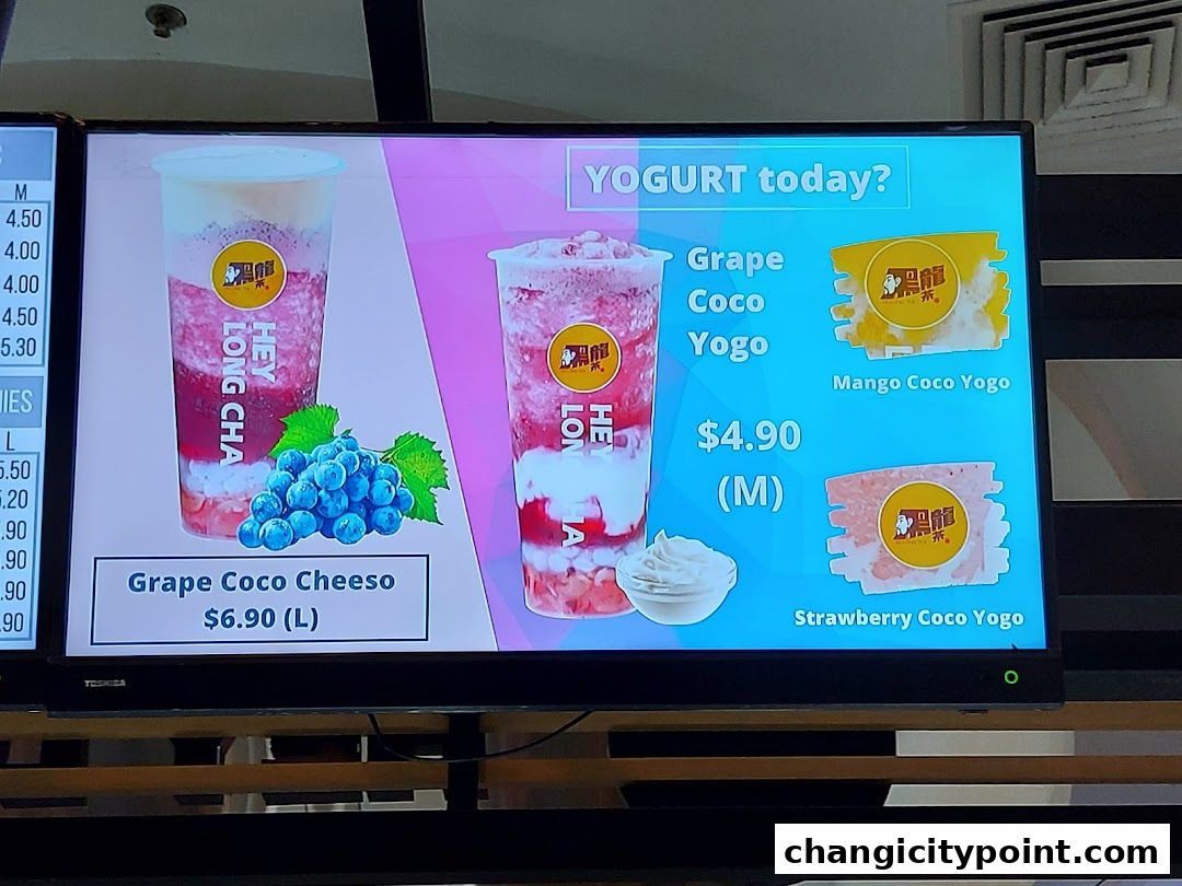 A digital menu board displaying yogurt drinks from Hey Long Cha.