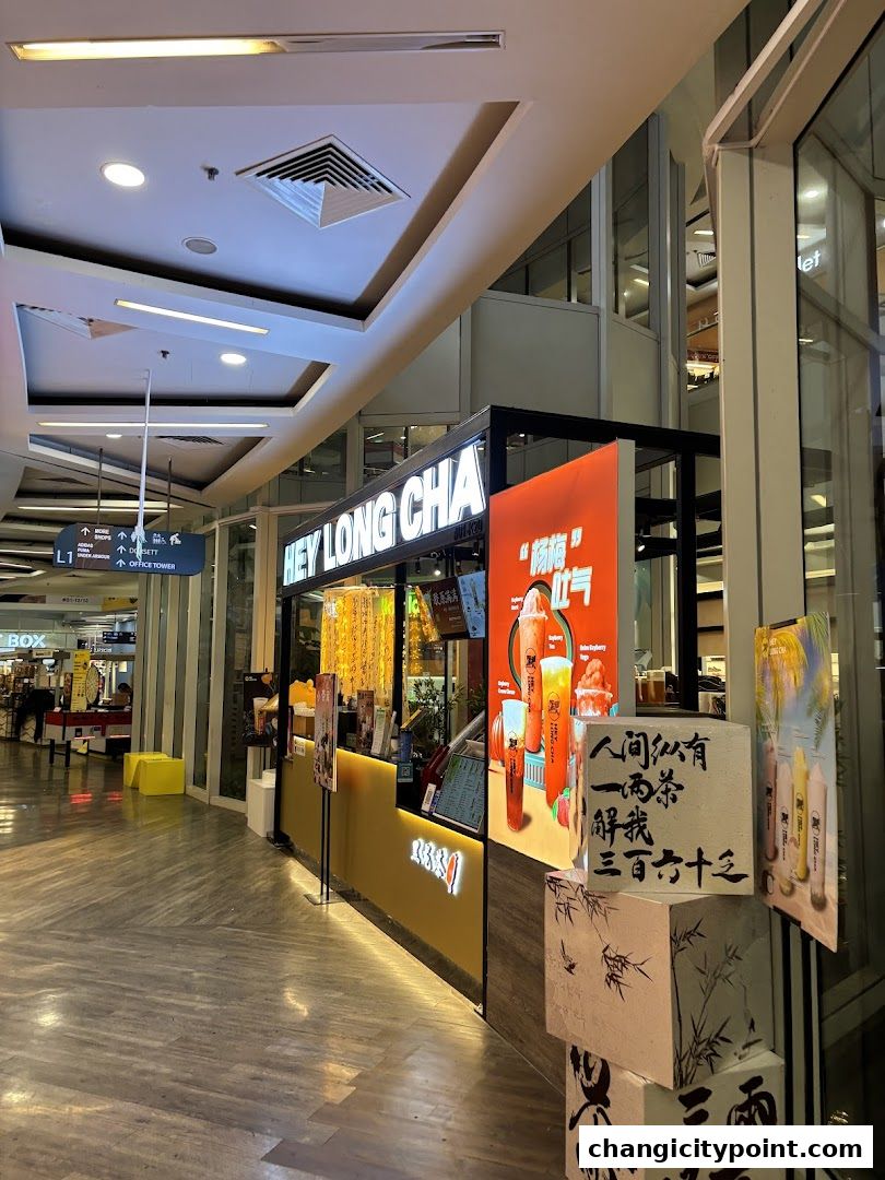 The exterior of a Hey Long Cha bubble tea shop with vibrant signage and drinks displayed.