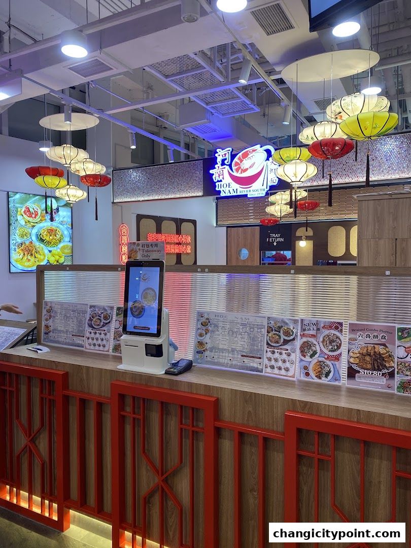 The entrance of Hoe Nam River South Prawn Noodles with menus displayed.