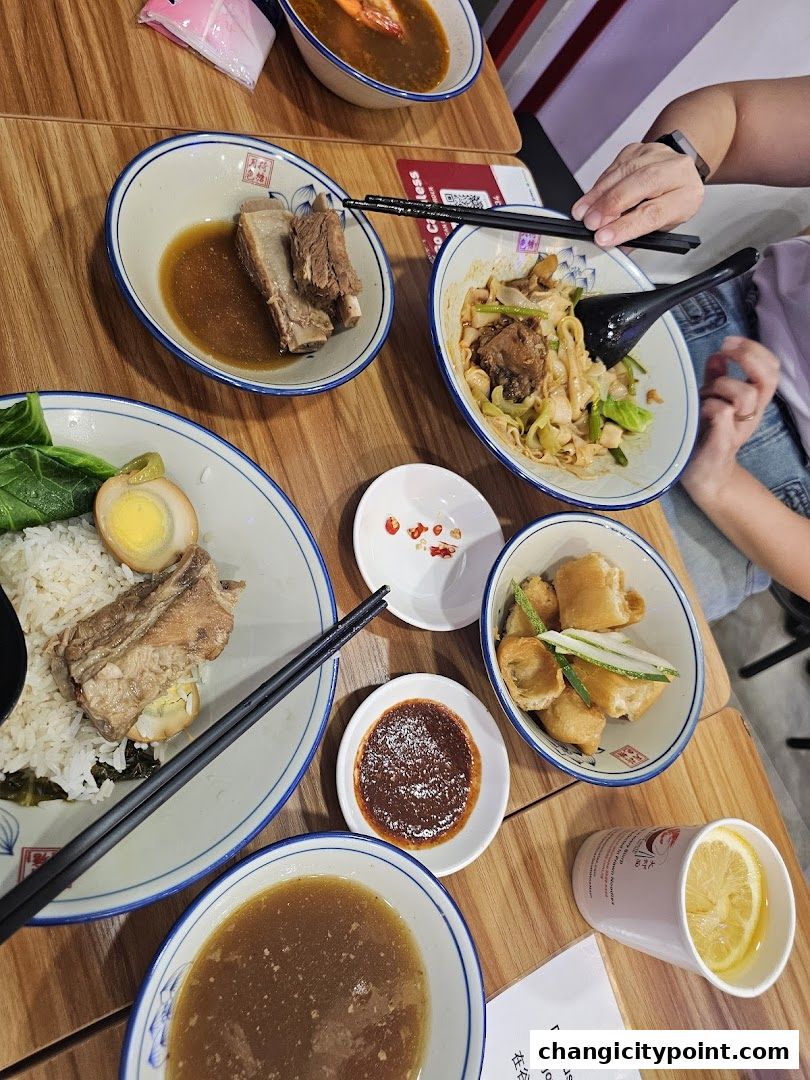 A table laden with delicious bowls of noodles, rice, and side dishes, ready to be enjoyed.