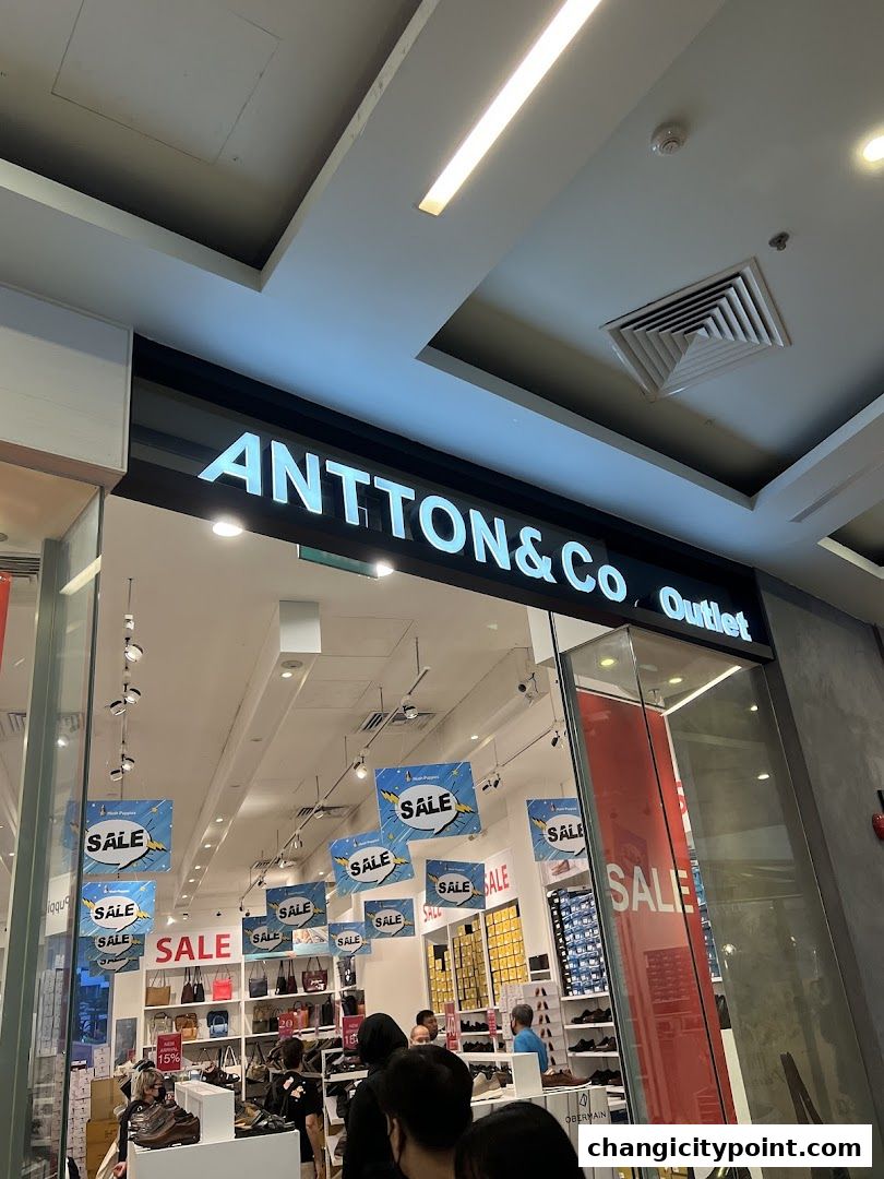 The storefront of Antton & Co. Outlet, featuring a sale with numerous 'SALE' signs.