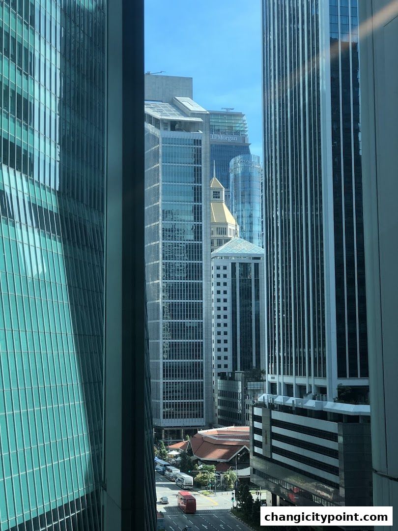 View of J.P. Morgan building amidst a cityscape with modern skyscrapers.