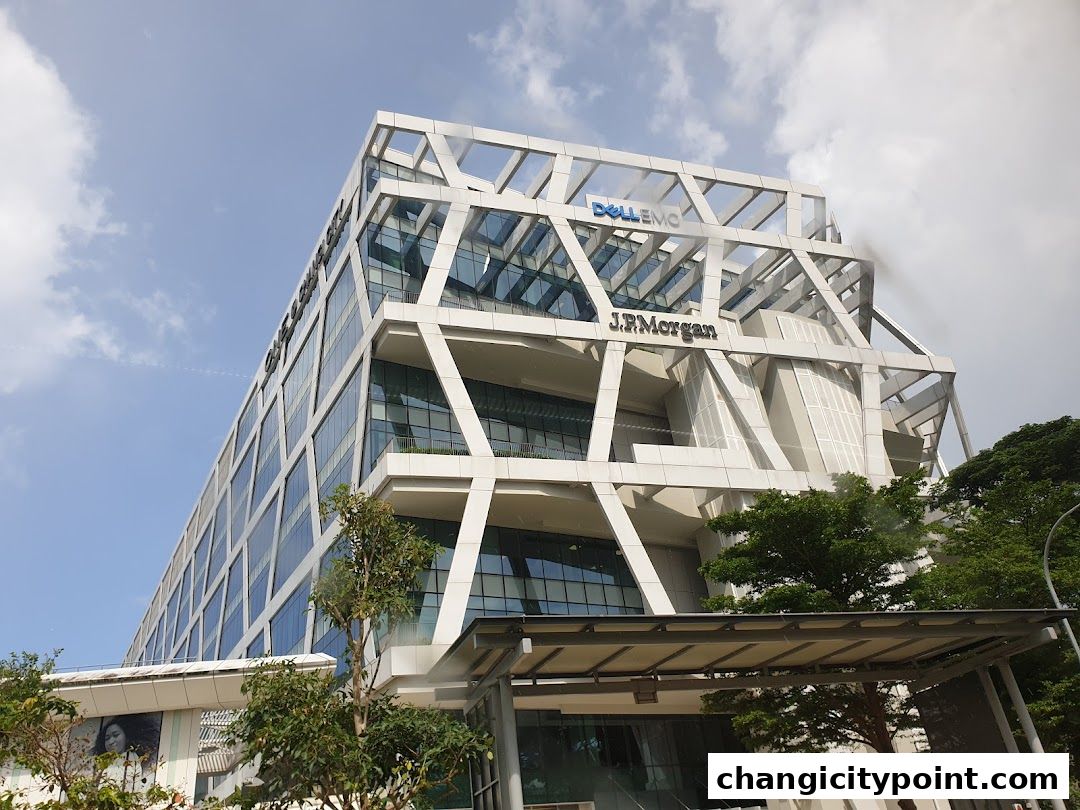 Modern office building exterior with J.P. Morgan and Dell EMC signage.