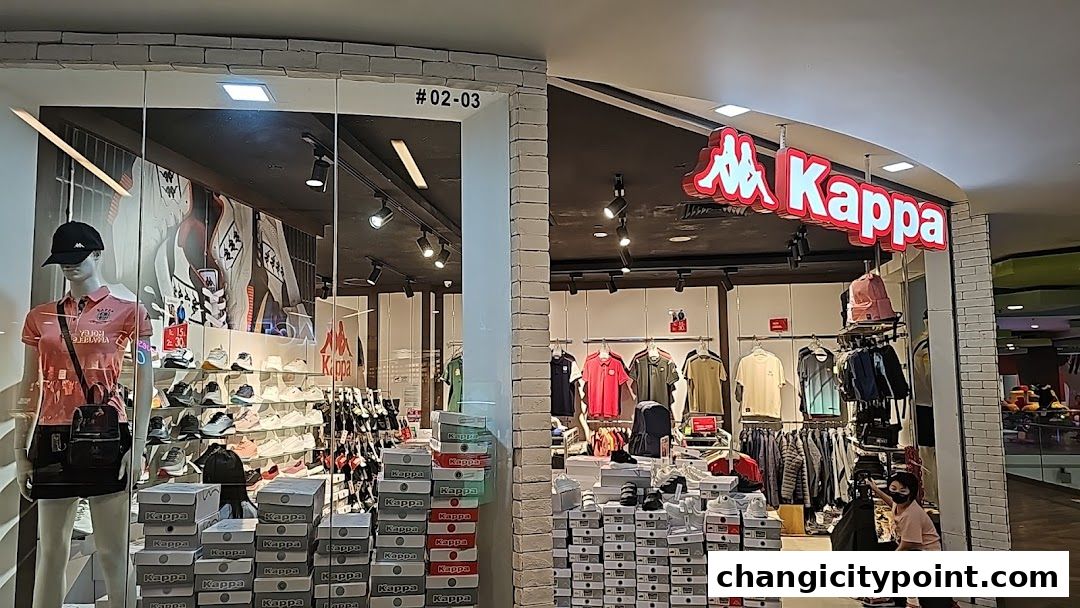Kappa store interior showcasing apparel, footwear, and accessories with mannequins and stacked boxes.