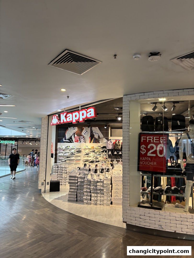 Kappa store entrance with shoes displayed and a 'Free $20 Kappa Voucher' sign.