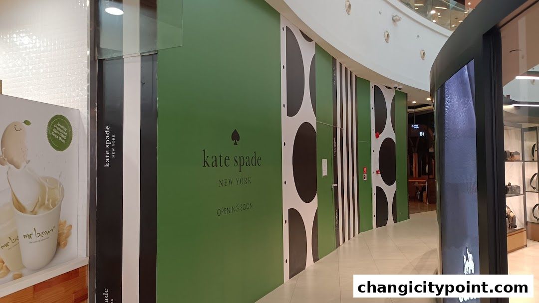 Kate Spade New York store under renovation with 'Opening Soon' signage.