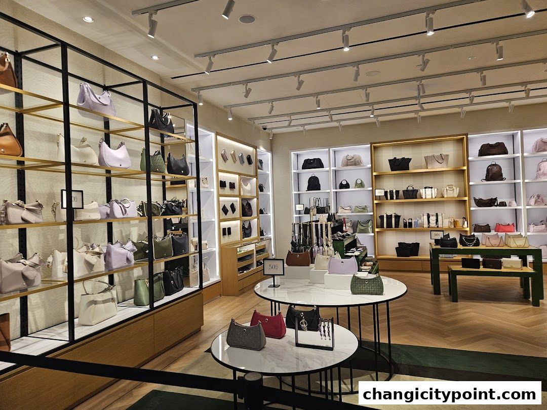 Interior view of a Kate Spade New York store showcasing handbags and accessories on display shelves.