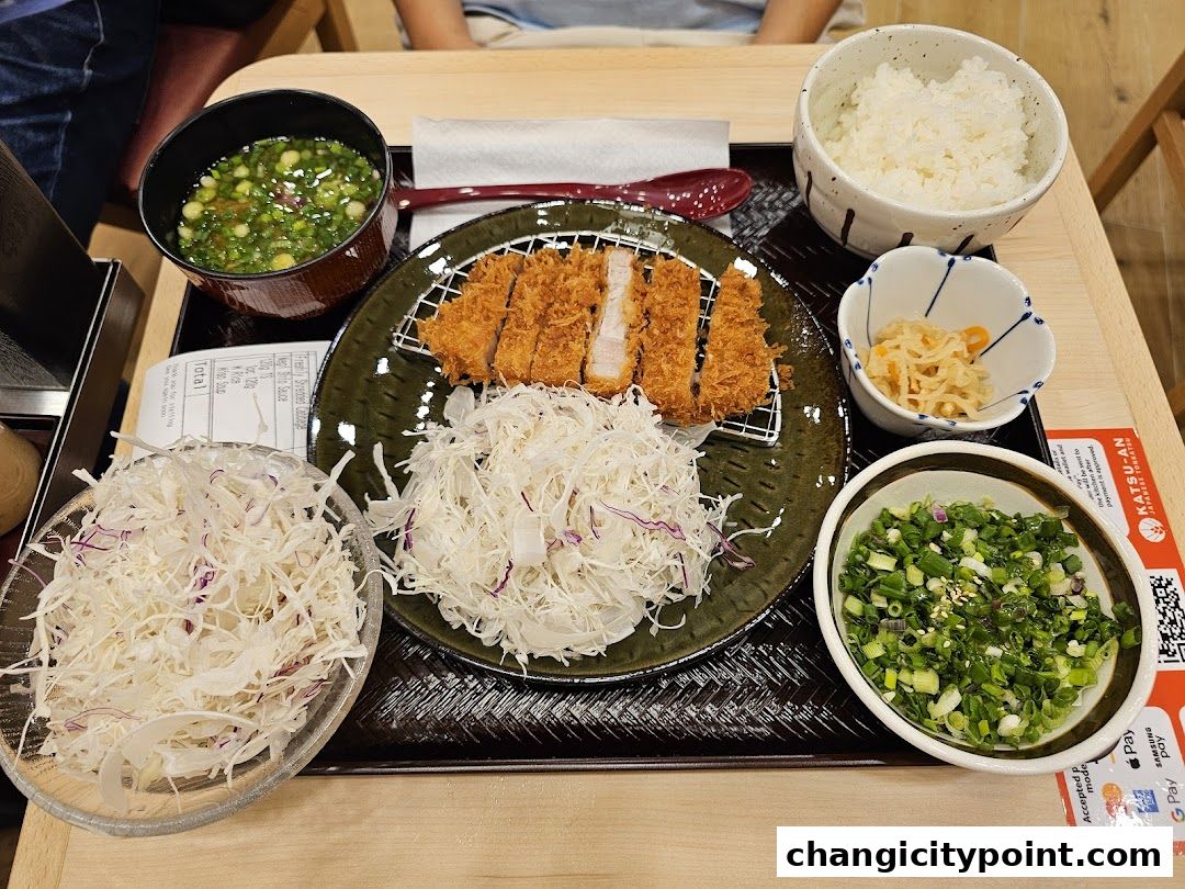 A delicious Katsu-an meal featuring crispy pork cutlet, rice, soup, and fresh cabbage.