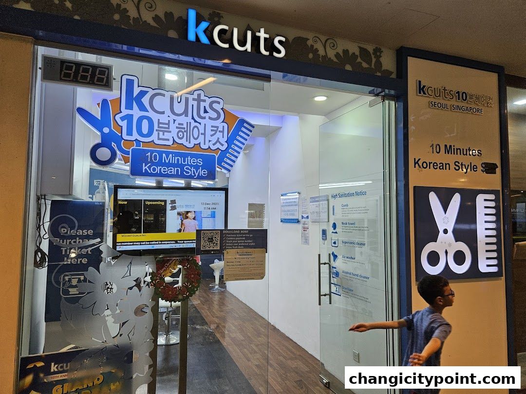 The entrance of a kcuts hair salon offering 10-minute Korean style haircuts.